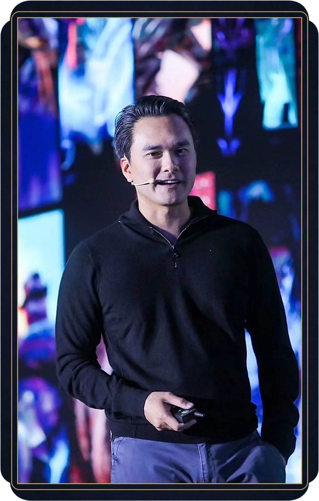 Thomas Vu speaking on stage, headset microphone, full color, at the Tencent Institute of Games. The collector's own card: a framed portrait plate.